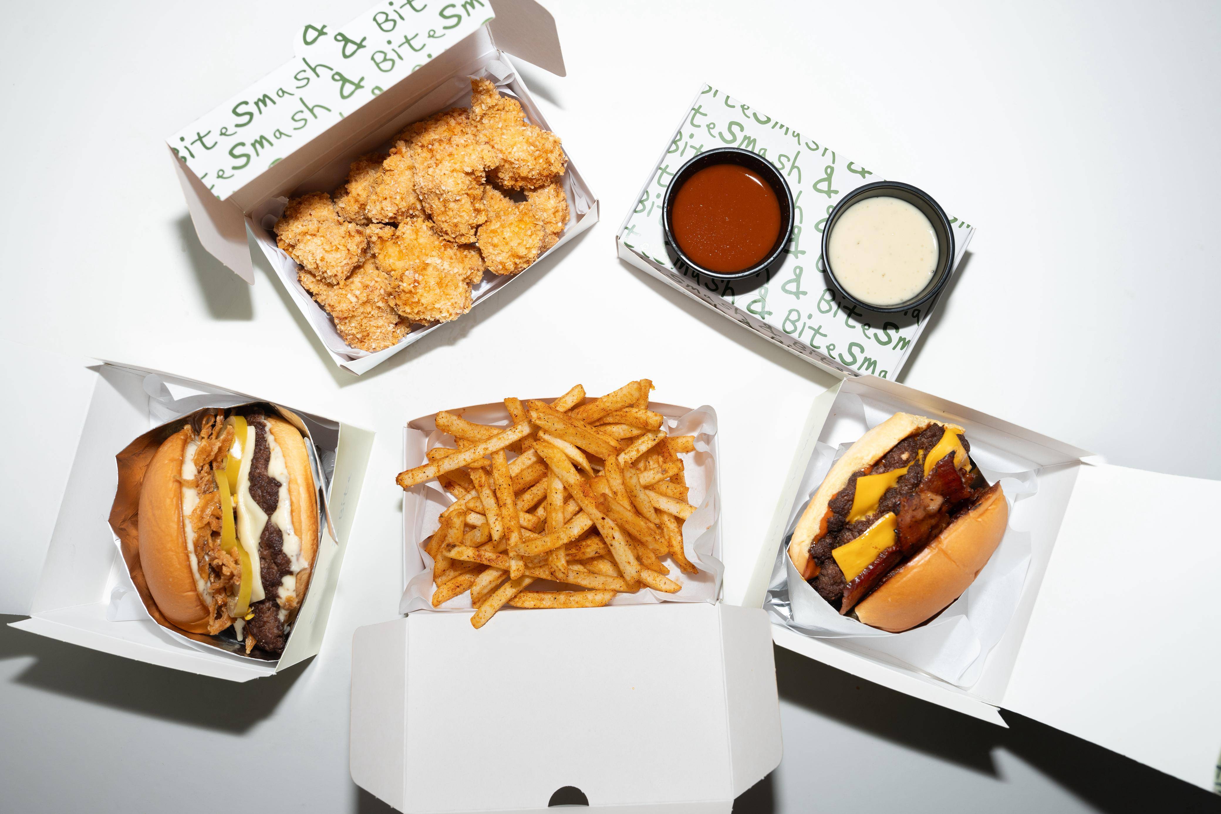 Smash & Bite burgers, chicken tenders, and fries