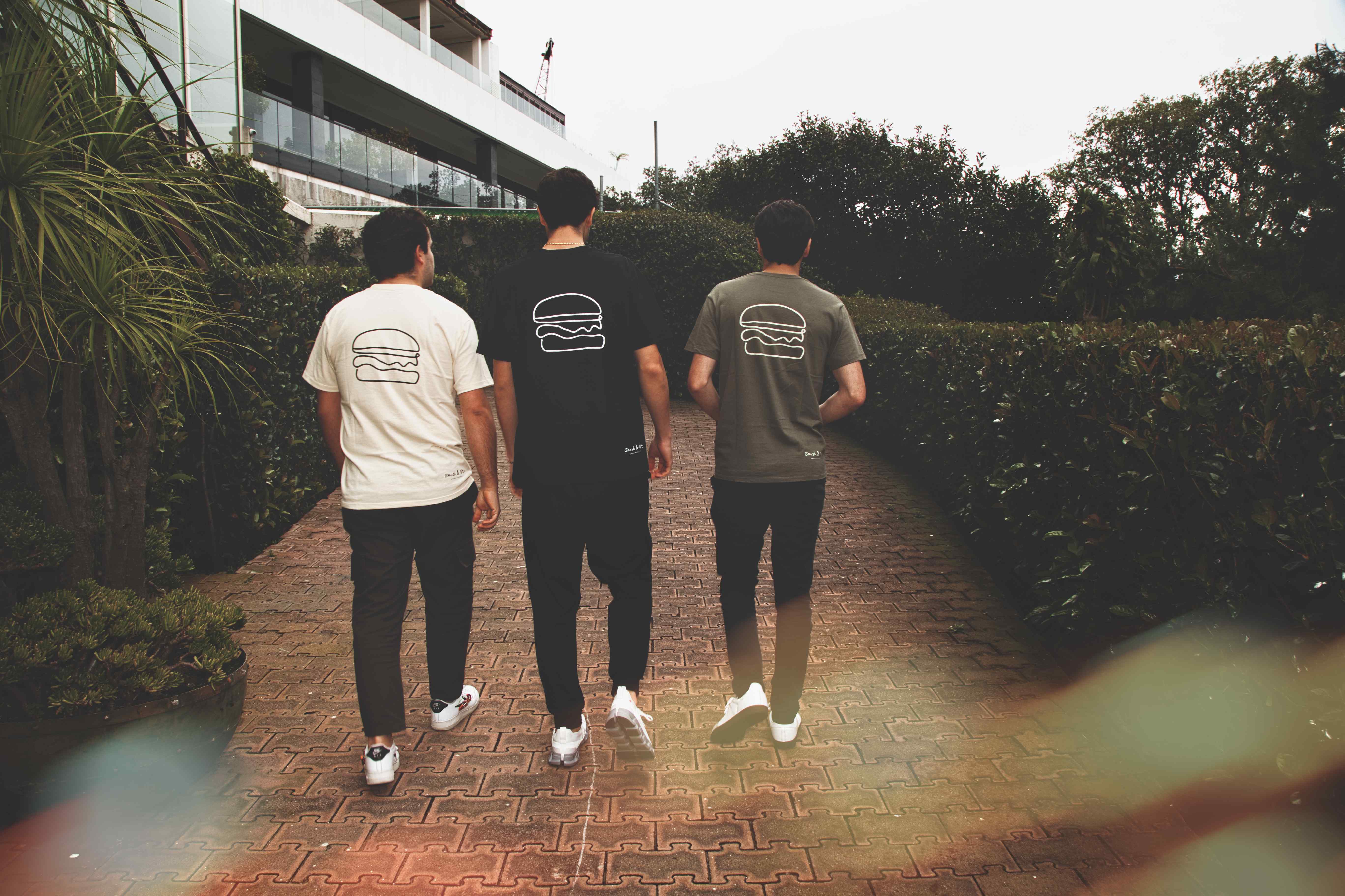 Friends enjoying Smash & Bite burgers